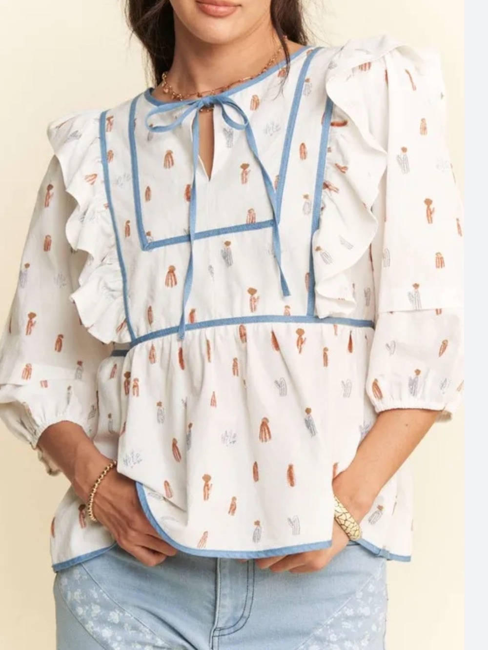 Shop Sassy Frass Boutique Paint Me A Cactus Ruffled Cotton Top.